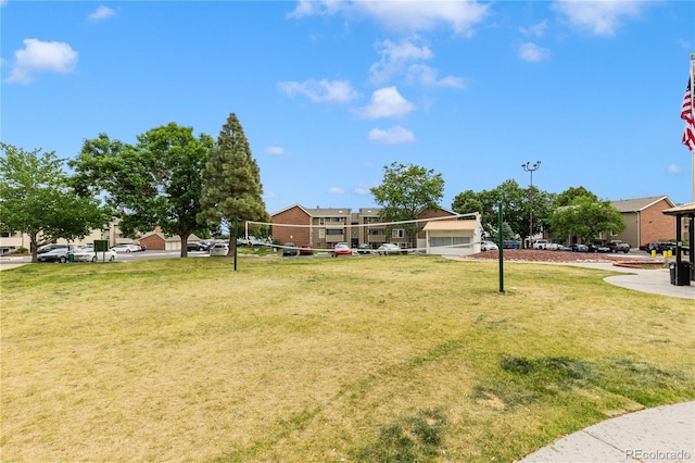 view of yard featuring volleyball court