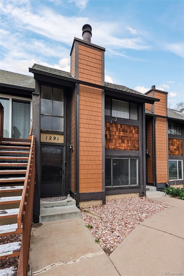 view of building exterior with entry steps