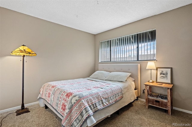 bedroom featuring carpet, a textured ceiling, and baseboards