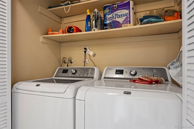 laundry room with washer and dryer and laundry area
