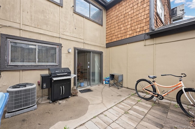 view of patio featuring a grill and central air condition unit