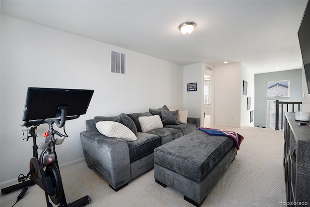 living area with recessed lighting, visible vents, light carpet, and baseboards