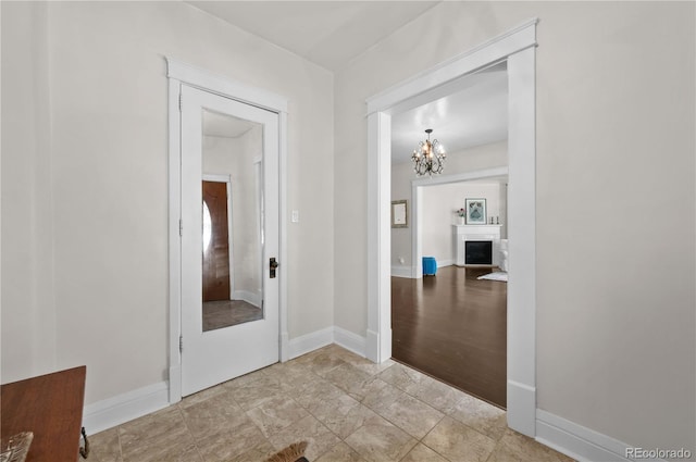 1024 Greenwood Ave, Canon City, CO 81212 - corridor with a chandelier and baseboards