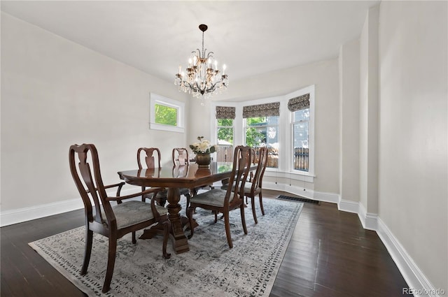 1024 Greenwood Ave, Canon City, CO 81212 - dining area with a chandelier and dark wood finished floors