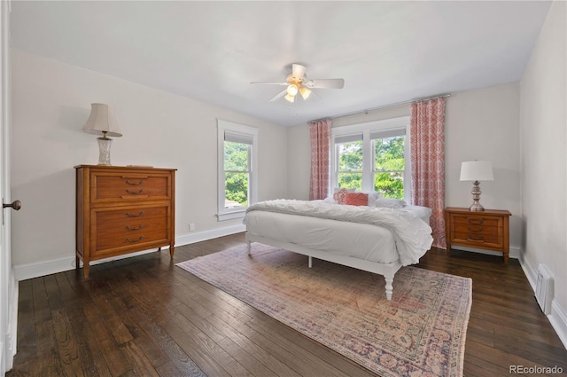 1024 Greenwood Ave, Canon City, CO 81212 - bedroom featuring dark wood finished floors, a ceiling fan, and a baseboard radiator