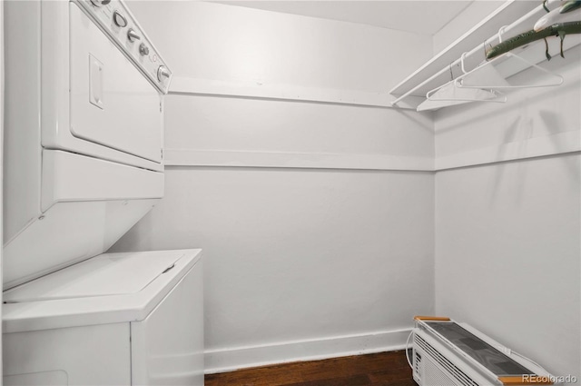 1024 Greenwood Ave, Canon City, CO 81212 - washroom with stacked washer and clothes dryer and dark wood finished floors