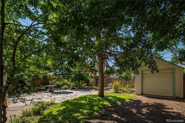 1024 Greenwood Ave, Canon City, CO 81212 - view of yard featuring a garage, an outbuilding, and driveway