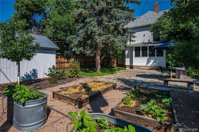 1024 Greenwood Ave, Canon City, CO 81212 - view of yard with a vegetable garden and a patio