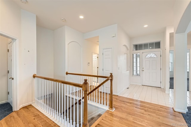 entrance foyer featuring light wood finished floors, recessed lighting, and baseboards