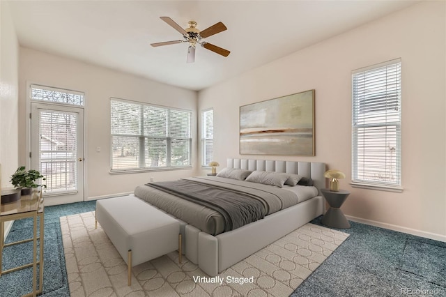 bedroom with access to exterior, carpet flooring, a ceiling fan, and baseboards