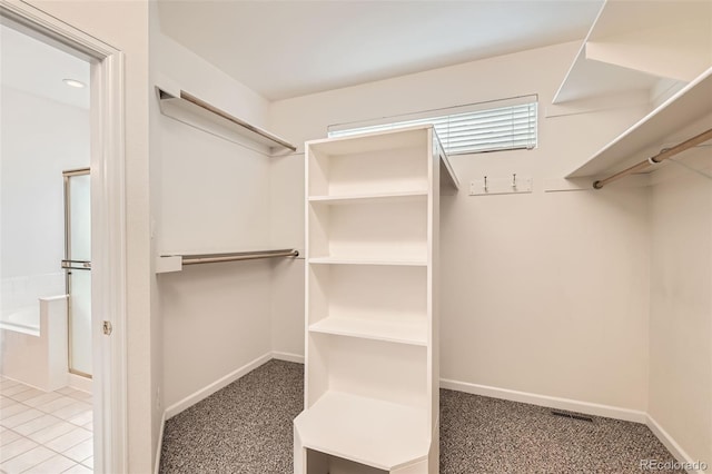 walk in closet with carpet and visible vents