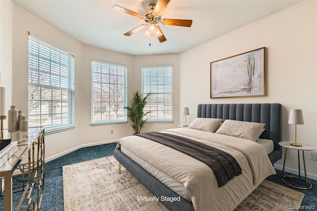 carpeted bedroom featuring a ceiling fan and baseboards