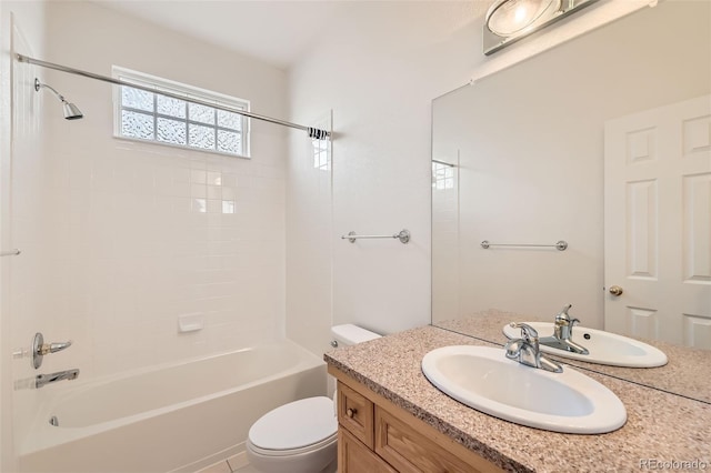 bathroom featuring shower / bath combination, toilet, and vanity