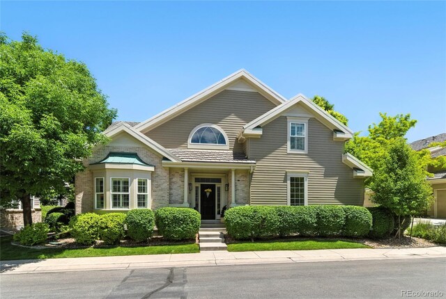 4545 S Monaco St Unit 114, Denver, CO 80237 - view of front facade featuring brick siding