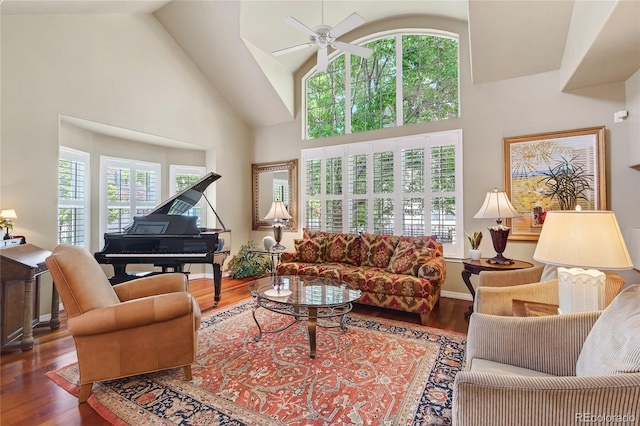 4545 S Monaco St Unit 114, Denver, CO 80237 - living room featuring plenty of natural light, a ceiling fan, wood finished floors, and high vaulted ceiling