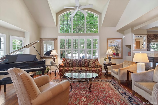 4545 S Monaco St Unit 114, Denver, CO 80237 - living area featuring wood finished floors, healthy amount of natural light, a ceiling fan, and high vaulted ceiling