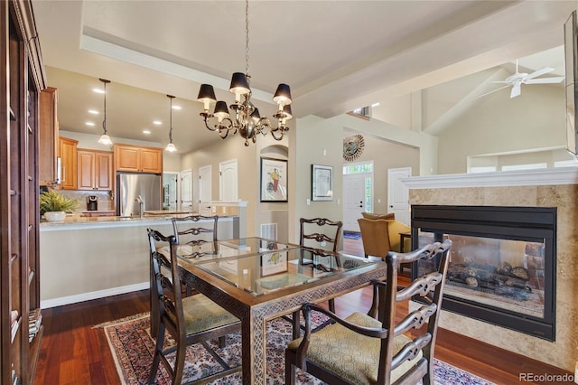 4545 S Monaco St Unit 114, Denver, CO 80237 - dining area featuring dark wood-style floors, a ceiling fan, a chandelier, a multi sided fireplace, and recessed lighting