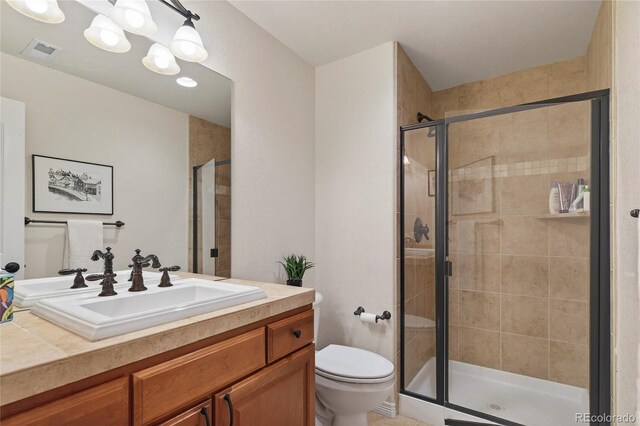 4545 S Monaco St Unit 114, Denver, CO 80237 - full bathroom featuring vanity and a stall shower