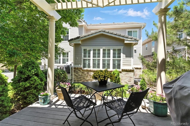 4545 S Monaco St Unit 114, Denver, CO 80237 - wooden deck with grilling area and a pergola