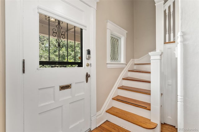 222 S Logan St, Denver, CO 80209 - entryway with stairway and light wood finished floors