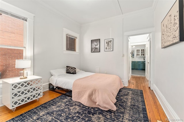 222 S Logan St, Denver, CO 80209 - bedroom featuring light wood-style flooring and crown molding