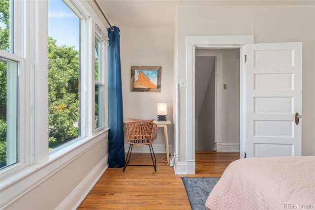 222 S Logan St, Denver, CO 80209 - bedroom featuring multiple windows and light wood-style floors