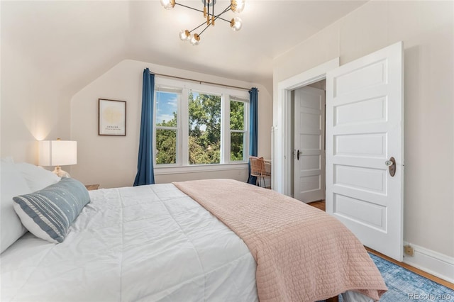 222 S Logan St, Denver, CO 80209 - bedroom with a chandelier, wood finished floors, and lofted ceiling