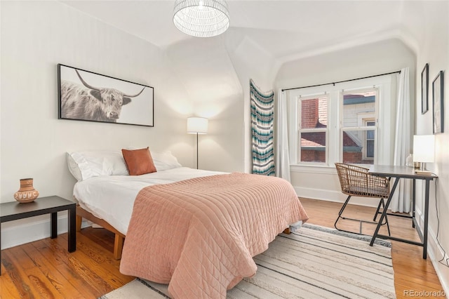 222 S Logan St, Denver, CO 80209 - bedroom with wood finished floors and baseboards