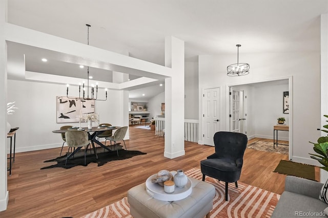 5554 S Ward Way, Littleton, CO 80127 - living room featuring a chandelier, wood finished floors, baseboards, and recessed lighting