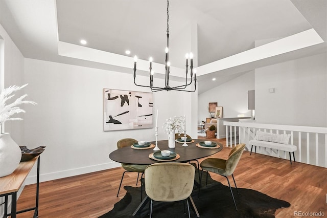 5554 S Ward Way, Littleton, CO 80127 - dining area with wood finished floors, recessed lighting, a chandelier, baseboards, and lofted ceiling