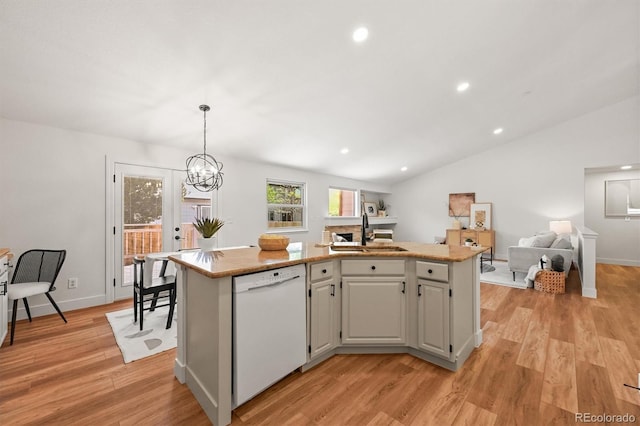 5554 S Ward Way, Littleton, CO 80127 - kitchen with dishwasher, a sink, open floor plan, light wood-type flooring, and recessed lighting