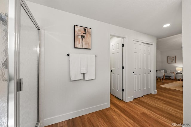5554 S Ward Way, Littleton, CO 80127 - hall featuring wood finished floors, baseboards, and recessed lighting