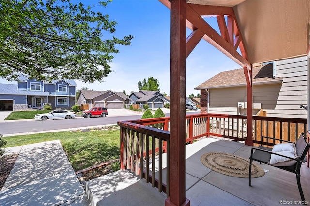 5554 S Ward Way, Littleton, CO 80127 - view of patio / terrace with a residential view and covered porch