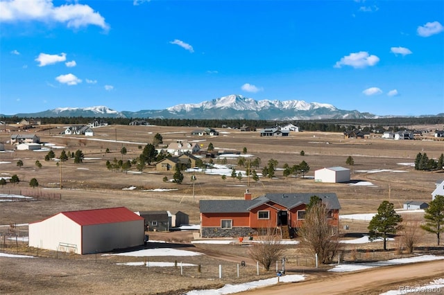 bird's eye view featuring a rural view and a mountain view