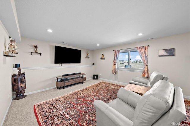 carpeted living room with visible vents, recessed lighting, and baseboards