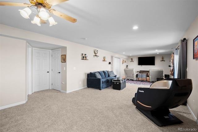 living area featuring recessed lighting, baseboards, carpet, and a ceiling fan