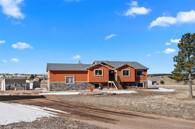 view of front of property with stone siding