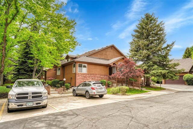 11820 W 66th Pl Unit C, Arvada, CO 80004 - view of front of property with brick siding and uncovered parking