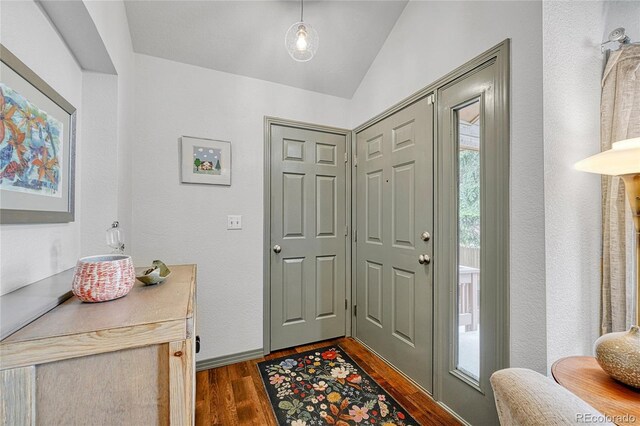 11820 W 66th Pl Unit C, Arvada, CO 80004 - entrance foyer featuring dark wood-style floors, lofted ceiling, and baseboards