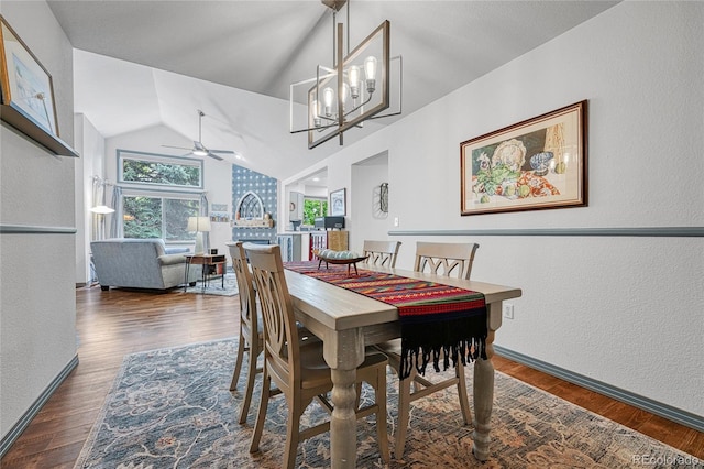 11820 W 66th Pl Unit C, Arvada, CO 80004 - dining space featuring ceiling fan, lofted ceiling, wood finished floors, a textured wall, and a chandelier