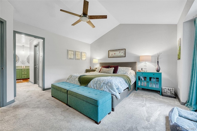 11820 W 66th Pl Unit C, Arvada, CO 80004 - bedroom with light carpet, vaulted ceiling, a ceiling fan, baseboards, and ensuite bathroom
