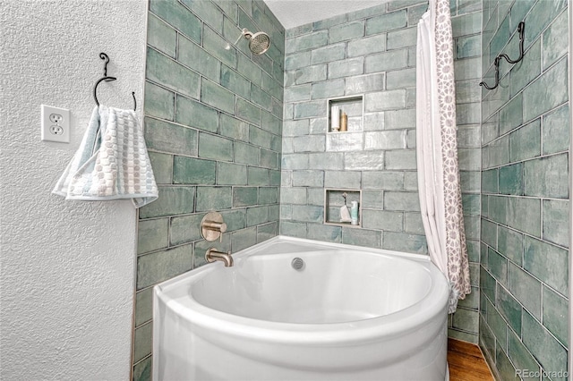 11820 W 66th Pl Unit C, Arvada, CO 80004 - bathroom featuring shower / tub combo with curtain and wood finished floors