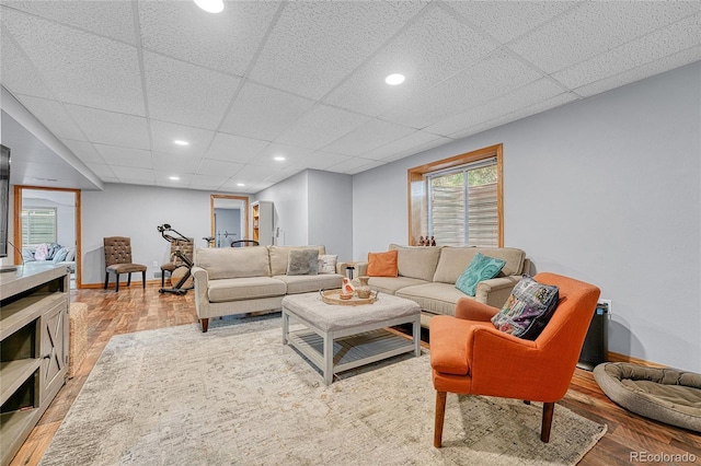 11820 W 66th Pl Unit C, Arvada, CO 80004 - living area with light wood finished floors, a drop ceiling, baseboards, and recessed lighting