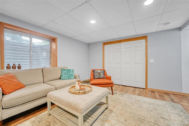 11820 W 66th Pl Unit C, Arvada, CO 80004 - living area featuring wood finished floors, a paneled ceiling, baseboards, and recessed lighting