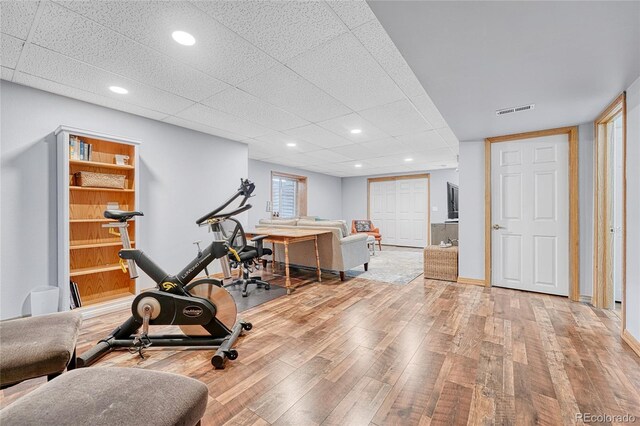 11820 W 66th Pl Unit C, Arvada, CO 80004 - exercise room with hardwood / wood-style flooring, recessed lighting, baseboards, and a paneled ceiling