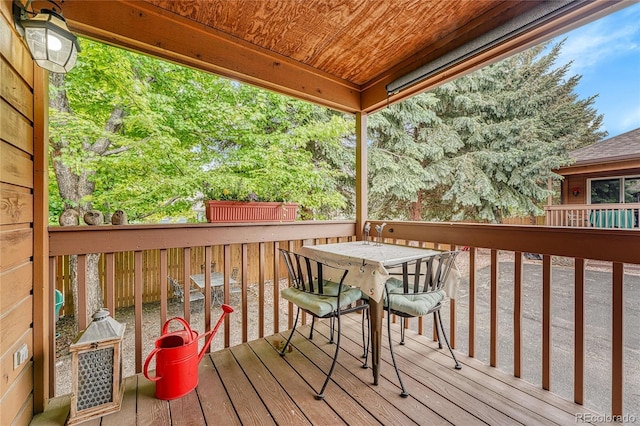 11820 W 66th Pl Unit C, Arvada, CO 80004 - wooden terrace featuring outdoor dining area