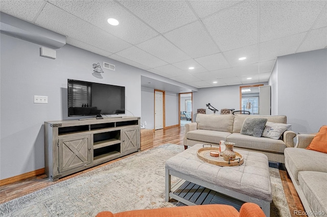 11820 W 66th Pl Unit C, Arvada, CO 80004 - living area featuring a drop ceiling, wood finished floors, baseboards, and recessed lighting