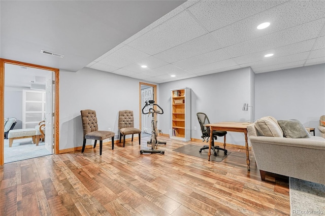 11820 W 66th Pl Unit C, Arvada, CO 80004 - sitting room with light wood-style floors, baseboards, recessed lighting, and a paneled ceiling