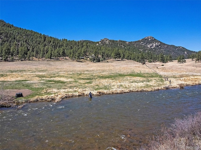 property view of mountains featuring a water view