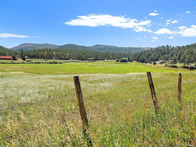 property view of mountains featuring a rural view